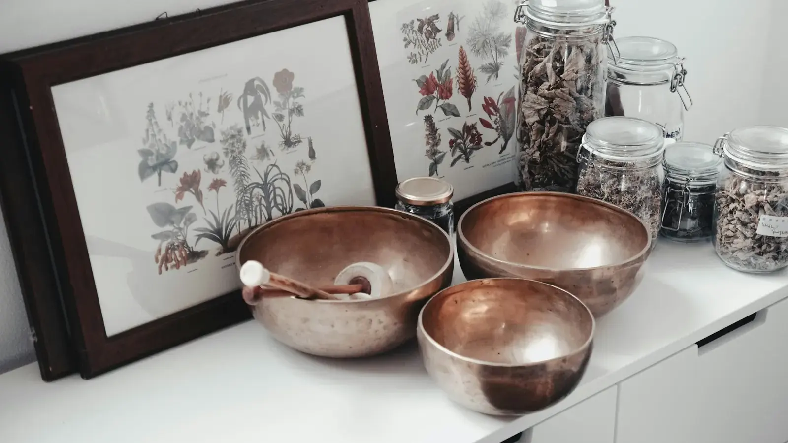 Herbal medicine jars and copper bowls in a naturopathic clinic